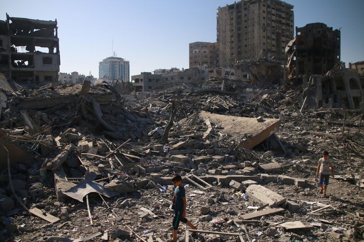 GAZA CITY, GAZA - OCTOBER 13: Palestinian citizens inspect damage to their homes caused by Israeli airstrikes on October 13, 2023 in Gaza City, Gaza. Israel has sealed off Gaza and launched sustained retaliatory air strikes, which have killed at least 1,400 people with more than 300,000 displaced, after a large-scale attack by Hamas. On October 7, the Palestinian militant group Hamas launched a surprise attack on Israel from Gaza by land, sea, and air, killing over 1,300 people and wounding around 2,800. Israeli soldiers and civilians have also been taken hostage by Hamas and moved into Gaza. The attack prompted a declaration of war by Israeli Prime Minister Benjamin Netanyahu and the announcement of an emergency wartime government. (Photo by Ahmad Hasaballah/Getty Images)