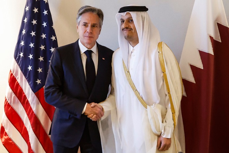 Anthony Blinken and Sheikh Mohammed bin Abdulrahman bin Jassim Al-Thani shake hands during a meeting in Amman.
