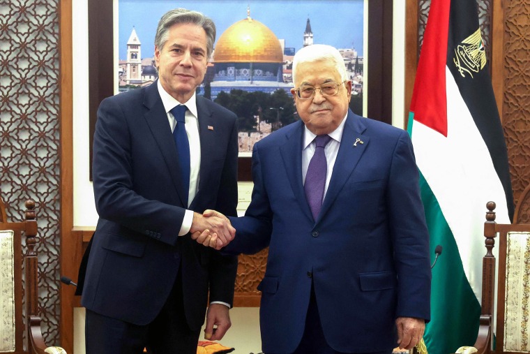 Mahmud Abbas and Secretary of State Antony Blinken shake handsduring a meeting.