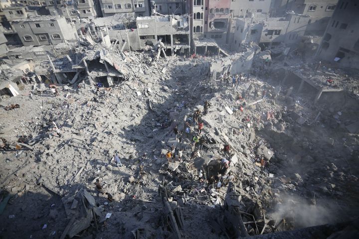 GAZA CITY, GAZA - NOVEMBER 02: Civilians conduct search and rescue operations and debris removal work at the heavily damaged buildings after Israeli attacks at Al Bureij Refugee Camp as Israeli attacks continue on the 27th day in Gaza City, Gaza on November 02, 2023. (Photo by Ashraf Amra/Anadolu via Getty Images)