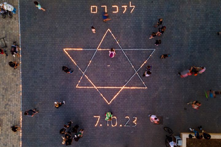 Israelis light candles in memory of the victims the Oct. 7 Hamas bloody cross-border attack in Raanana, Israel, on Nov. 7, 2023. 