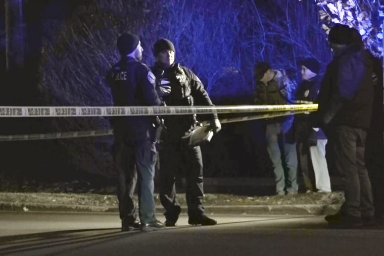 Officers work at a crime scene.