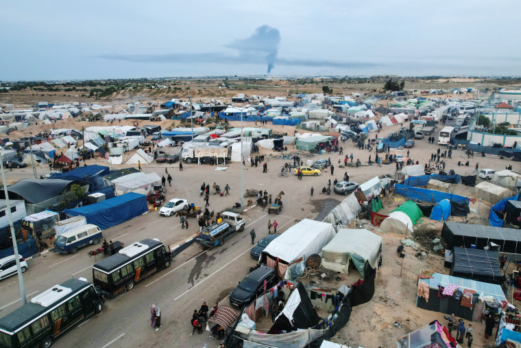 Displaced Palestinians who fled Khan Younis set up camp in Rafah near the Gaza Strip's border with Egypt on Dec. 7, 2023. 