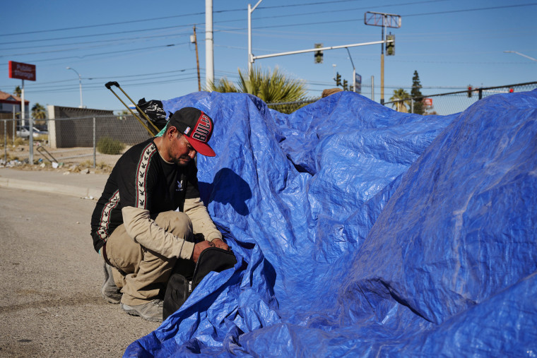 Frank Lucero sorts through belongings on December 5, 2023 in Las Vegas, Nevada.