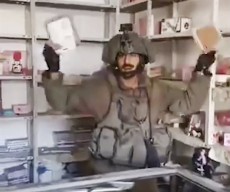 An Israel soldier rummaging through private homes in Gaza.