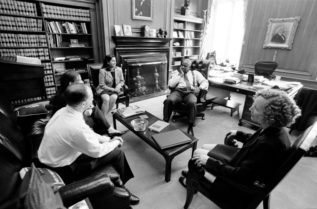Supreme Court Justice Clarence Thomas meets with his law clerks during the 2001-2002 term.