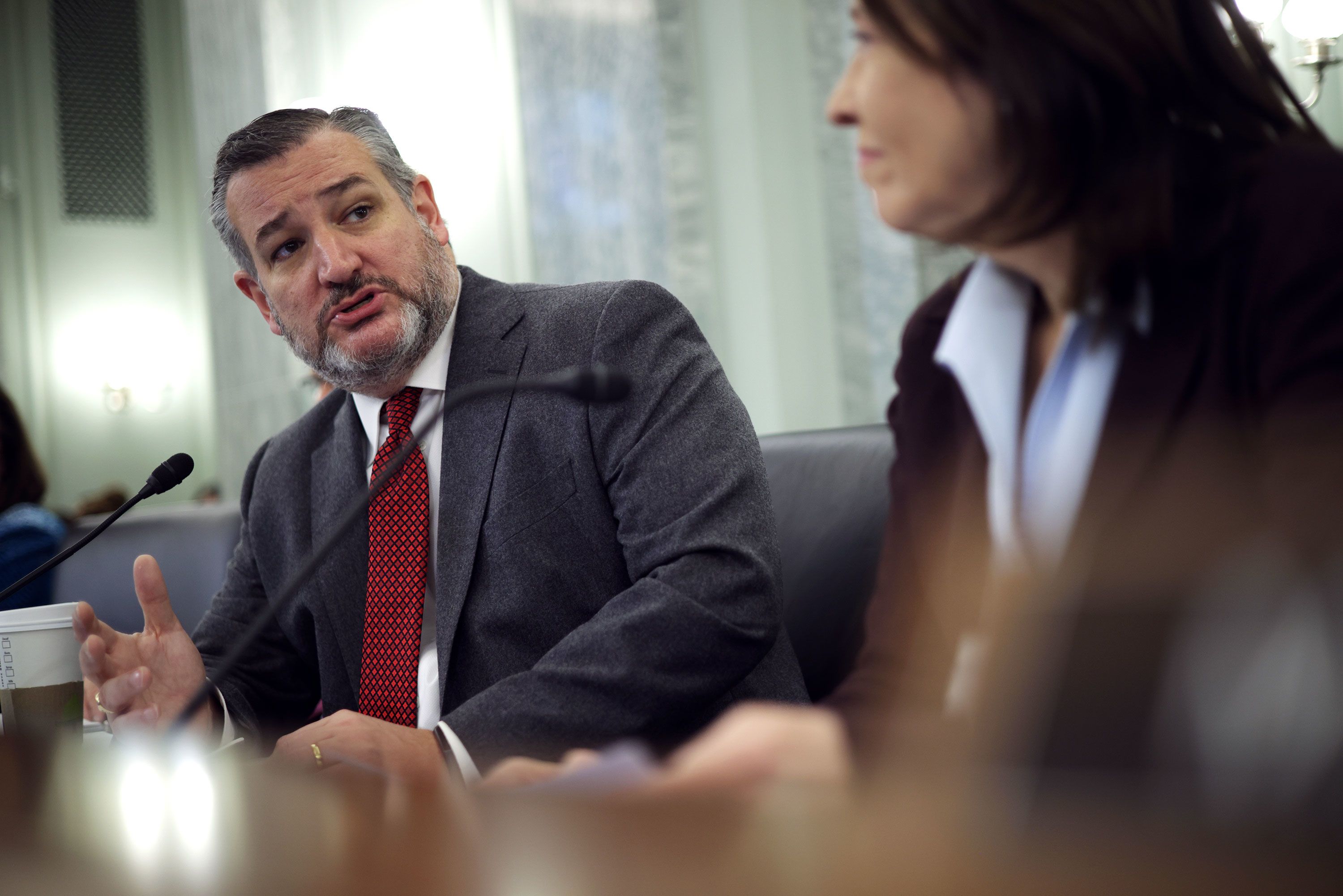 WASHINGTON, DC - FEBRUARY 09: Committee Chairman Sen. Maria Cantwell (D-WA) (R) listens as ranking member Sen. Ted Cruz (R-TX) (2nd R) speaks during a hearing before Senate Commerce, Science and Transportation Committee at Russell Senate Office Building on Capitol Hill February 9, 2023 in Washington, DC. The committee held a hearing on