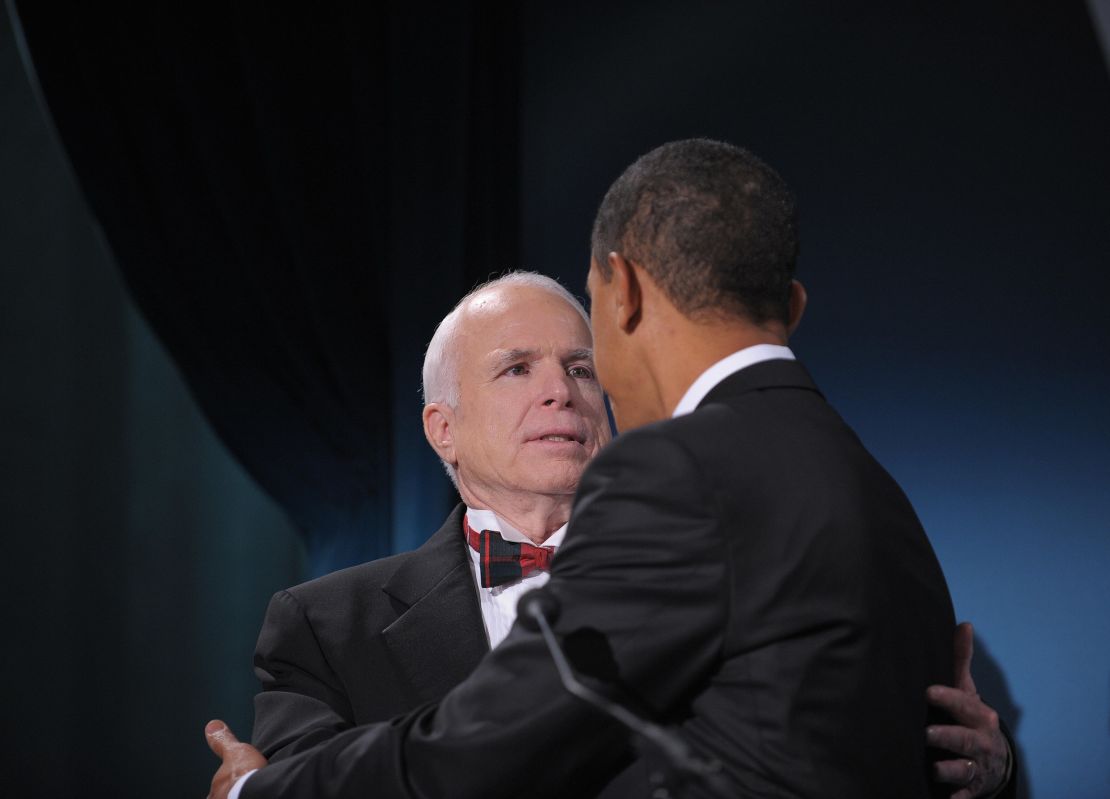 US President-elect Barack Obama greets Arizona Senator John McCain, the former Republican presidential candidate, during a bipartisan dinner in McCain�s honour January 19, 2009 in Washington, DC, on the night before Obama's inauguration as the 44th US President. AFP PHOTO / Mandel NGAN (Photo credit should read MANDEL NGAN/AFP via Getty Images)