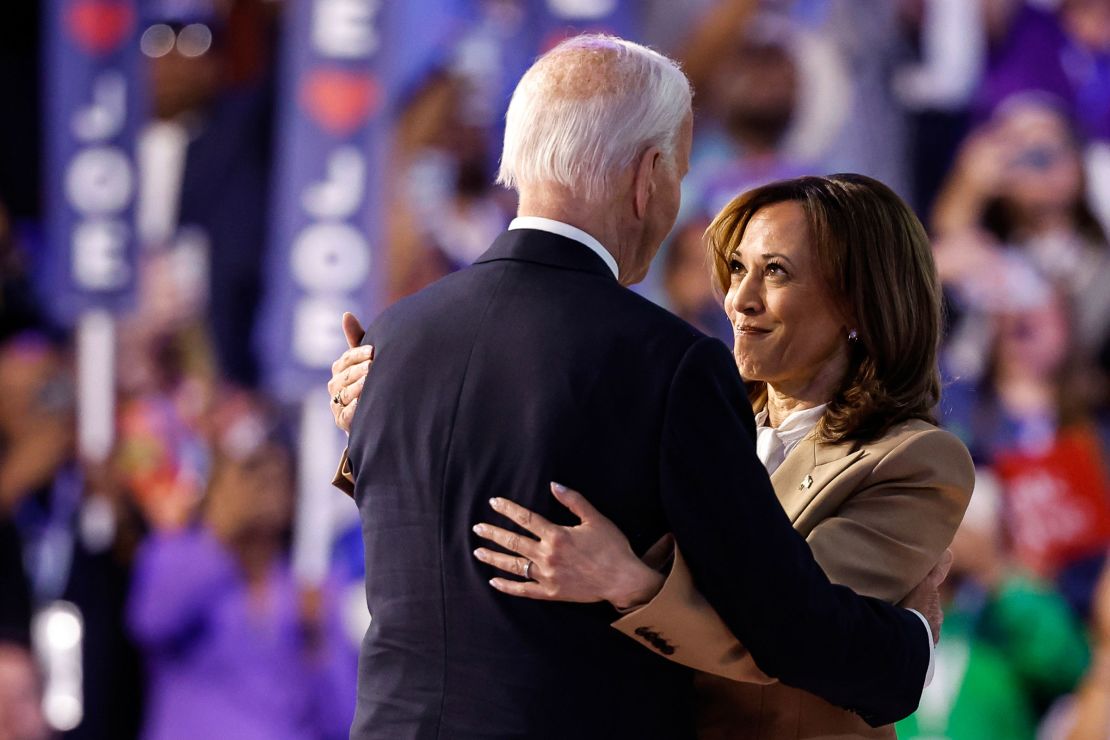 Vice President Kamala Harris, right, and President Joe Biden greet each other at the end of the first day of the Democratic National Convention at the United Center on August 19 in Chicago.